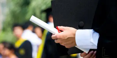 Student holding a diploma