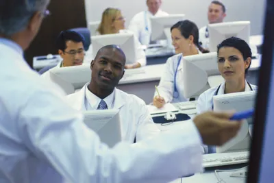 Healthcare workers listening to a lecture