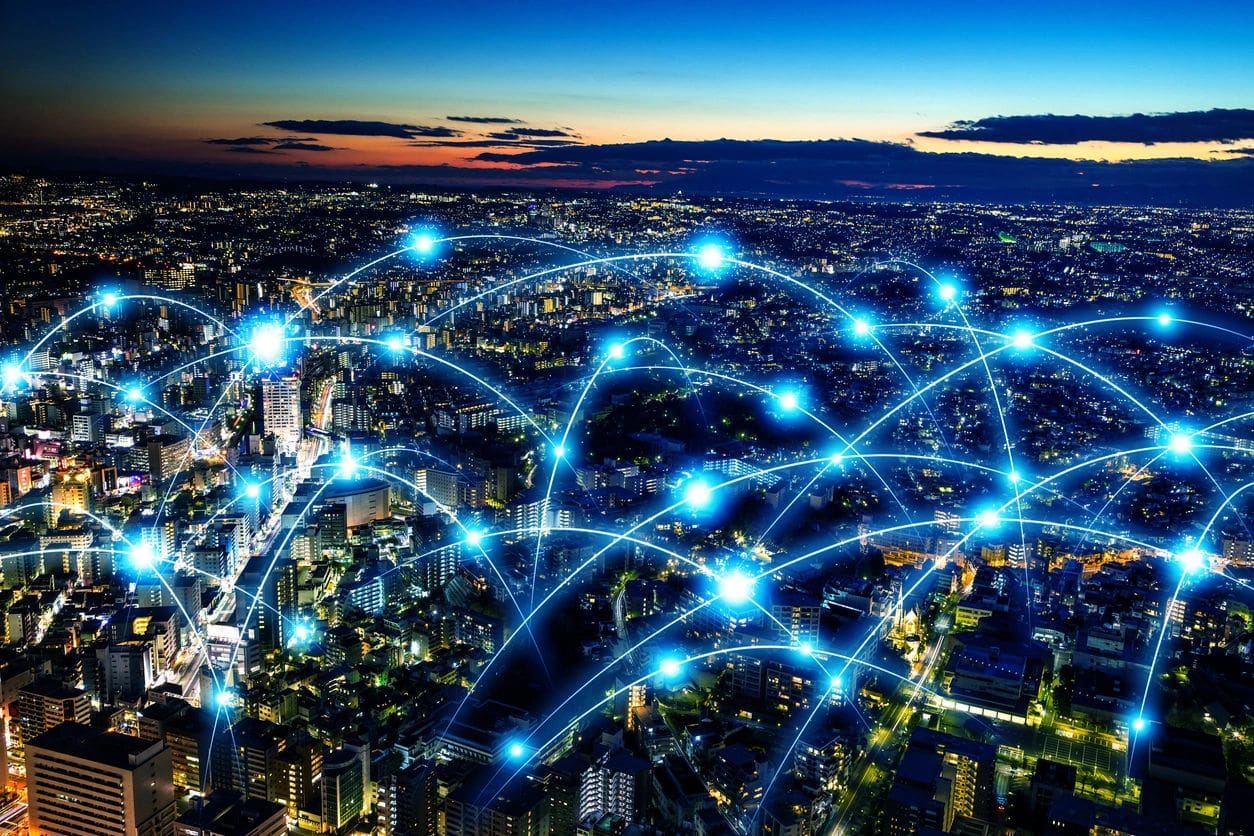 Blue lines that represent data are spread throughout a city, showing the interconnectedness of data.